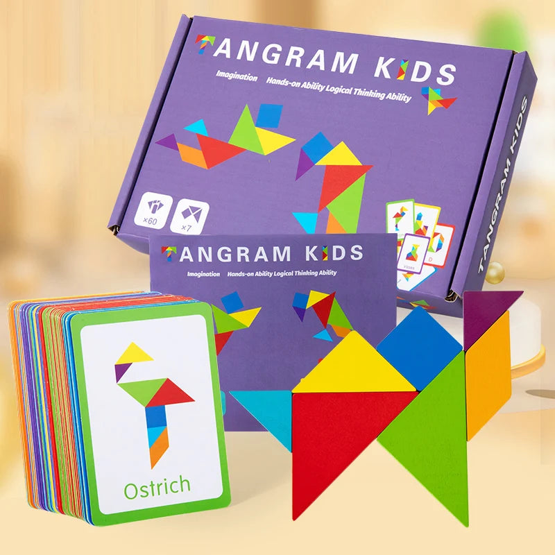 A box of Angram Kids tangram puzzles and a stack of wooden puzzle pieces shaped like an ostrich on a light surface.