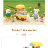 A yellow dessert cart miniature set featuring various food items and doll figures in a grassy landscape.