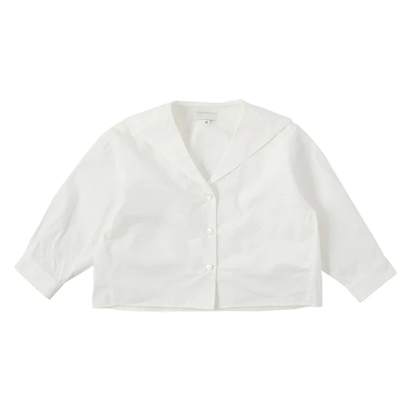 White collared shirt or lightweight jacket for a child