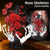 A dark skeleton hand and rose cross building set featuring red roses and white skeletal hands.