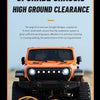 Orange 1:18 scale 4WD RC Jeep demonstrating upgraded chassis high ground clearance on sand.