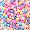 A close-up view of various colored matte acrylic beads used for jewelry making.