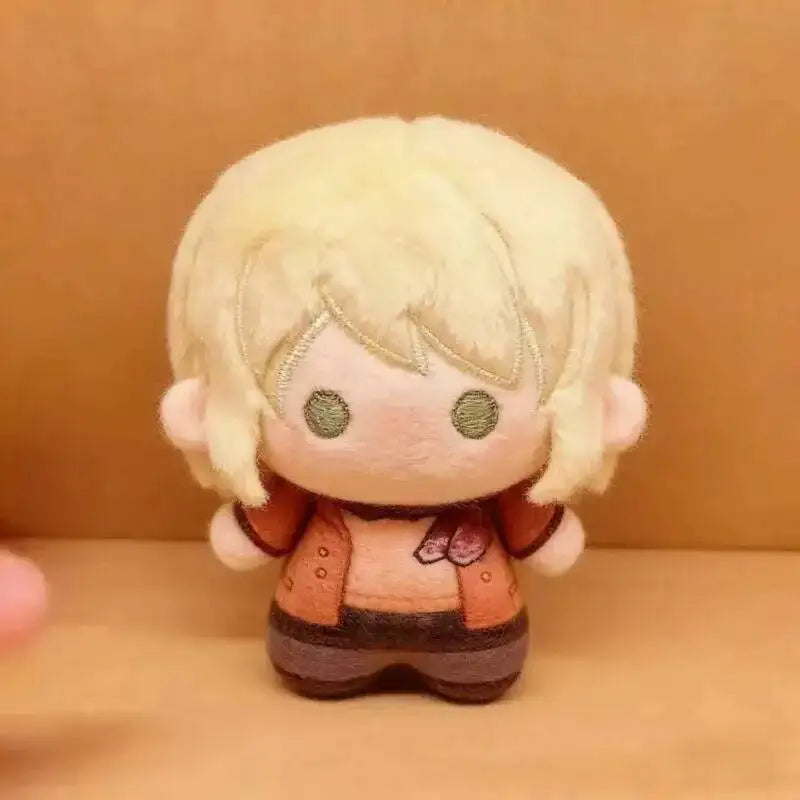 A plush doll set of Leon and Ashley from Resident Evil 9 with blonde hair and orange clothing.