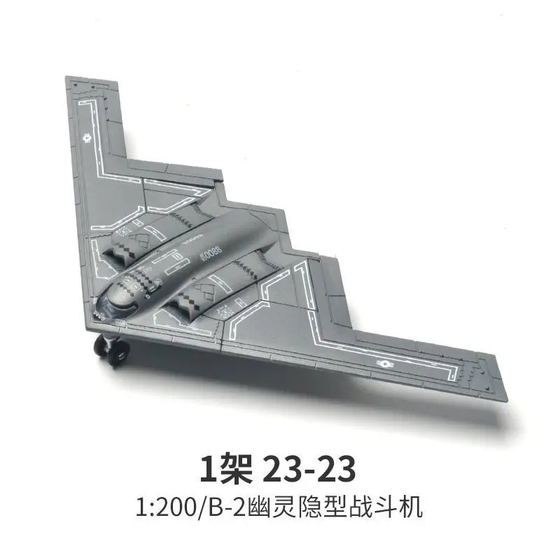 A 1:200 scale model kit of an B-2 stealth fighter aircraft built from gray plastic parts.