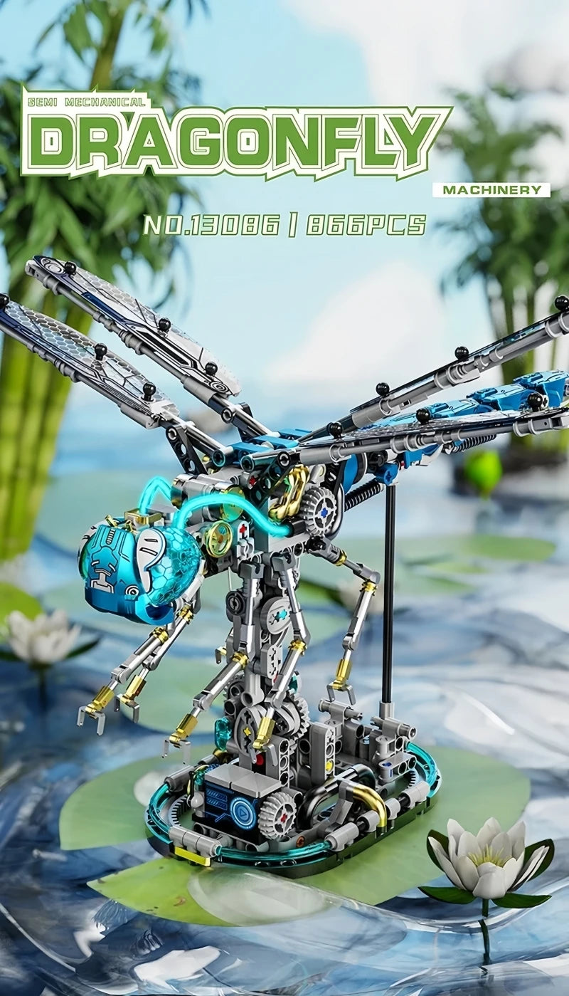 A detailed mechanical model of a dragonfly, featuring silver and blue components, displayed on a green surface.