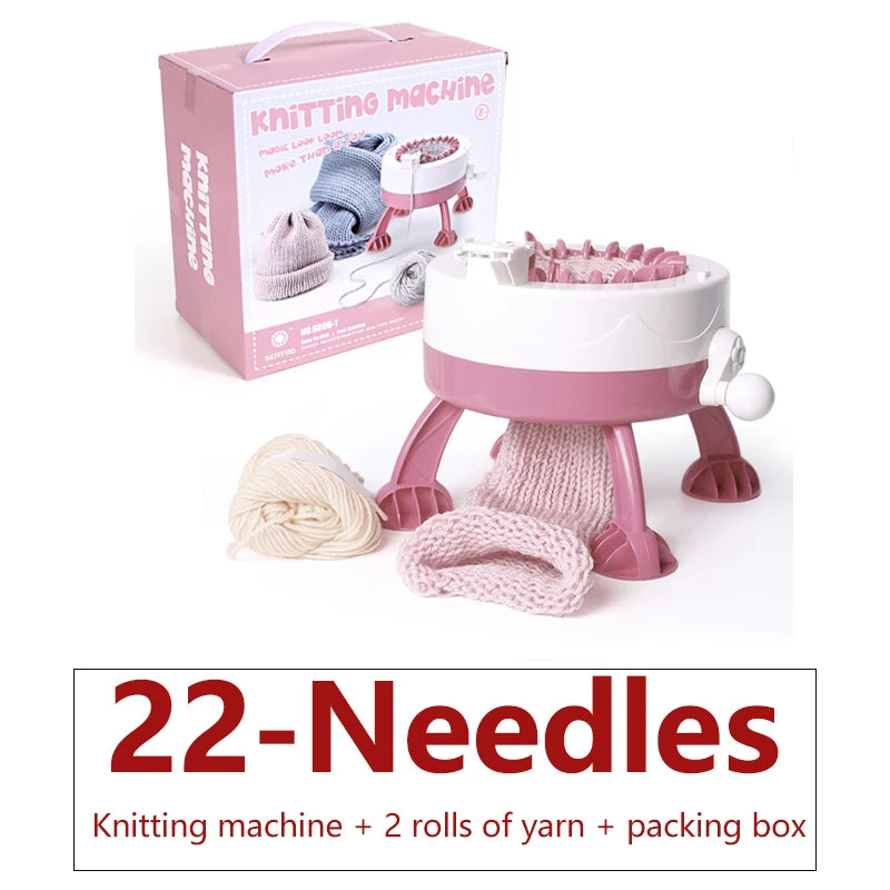 A pink manual knitting machine with 22 needles, along with two rolls of yarn and its packaging box.