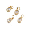 Three gold-toned rhinestone heart charms for jewelry making displayed against a white background.