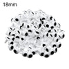 A pile of 18mm plastic safety eyes used for amigurumi and stuffed animals.