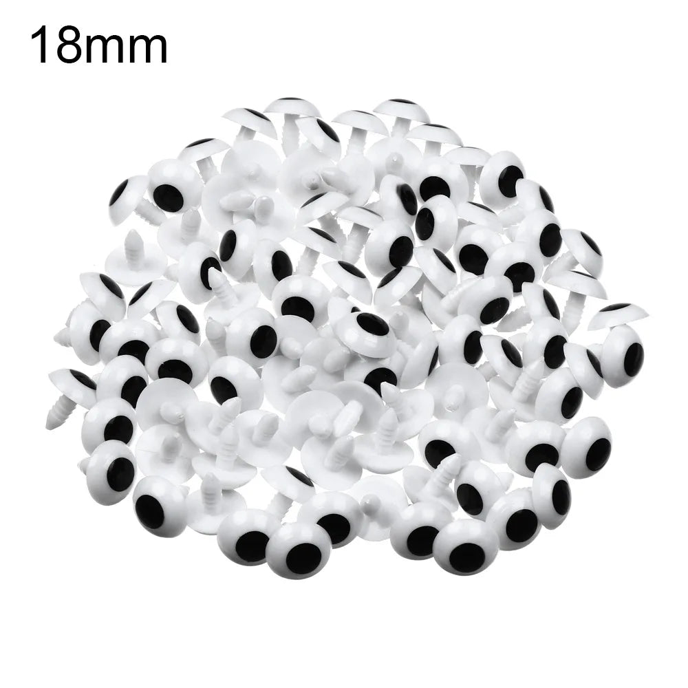 A pile of 18mm plastic safety eyes used for amigurumi and stuffed animals.
