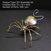 A finished steampunk metal spider model assembled from parts, featuring metallic limbs and a decorative dome.