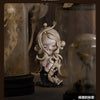 A pale, sculpted figure with flowing hair is displayed in a glass jar against a dark background.
