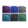 A clear plastic container filled with various colors of crushed glass stones for resin and craft projects.