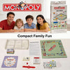 A Monopoly board game box and components displayed on a table, featuring the classic board and playing pieces.