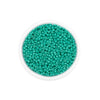 A clear container filled with small, round, teal glass seed beads for jewelry making.
