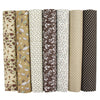 A pack of seven vertically striped cotton fabric squares in various earthy tones for quilting and patchwork projects.