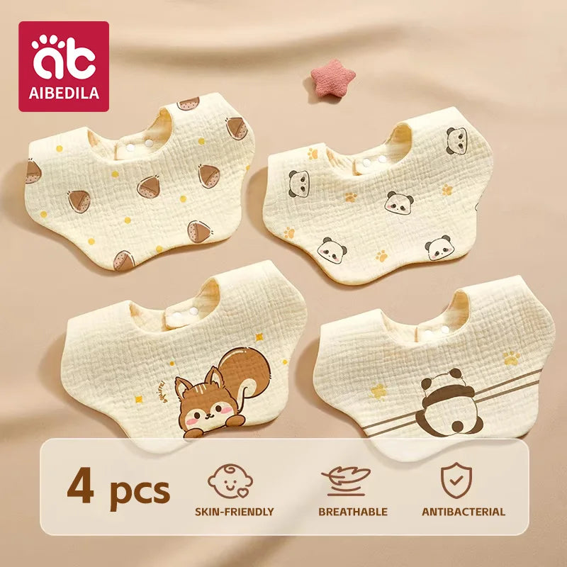 A pack of four soft cotton gauze baby bandana bibs with various cute animal patterns for burping and feeding.