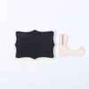 A black wooden chalkboard sign with a matching light wood easel for display.