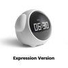A white, spherical alarm clock with a digital display showing 06:30 and a curved light panel.