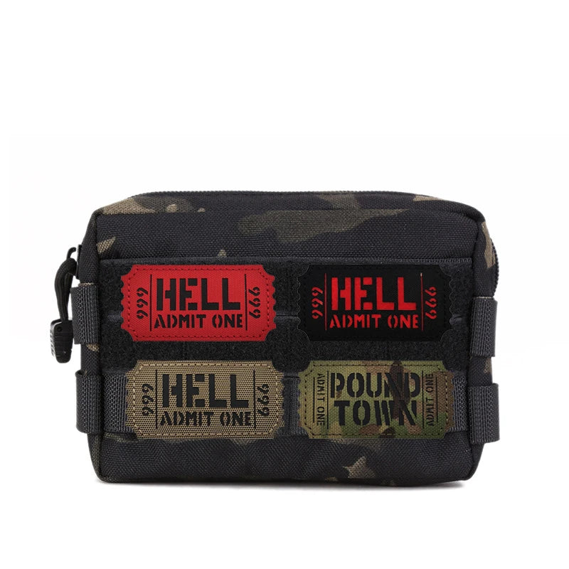 A dark camouflage patch featuring the text HELL ADMIT ONE and POUND TOWN on a tactical item.