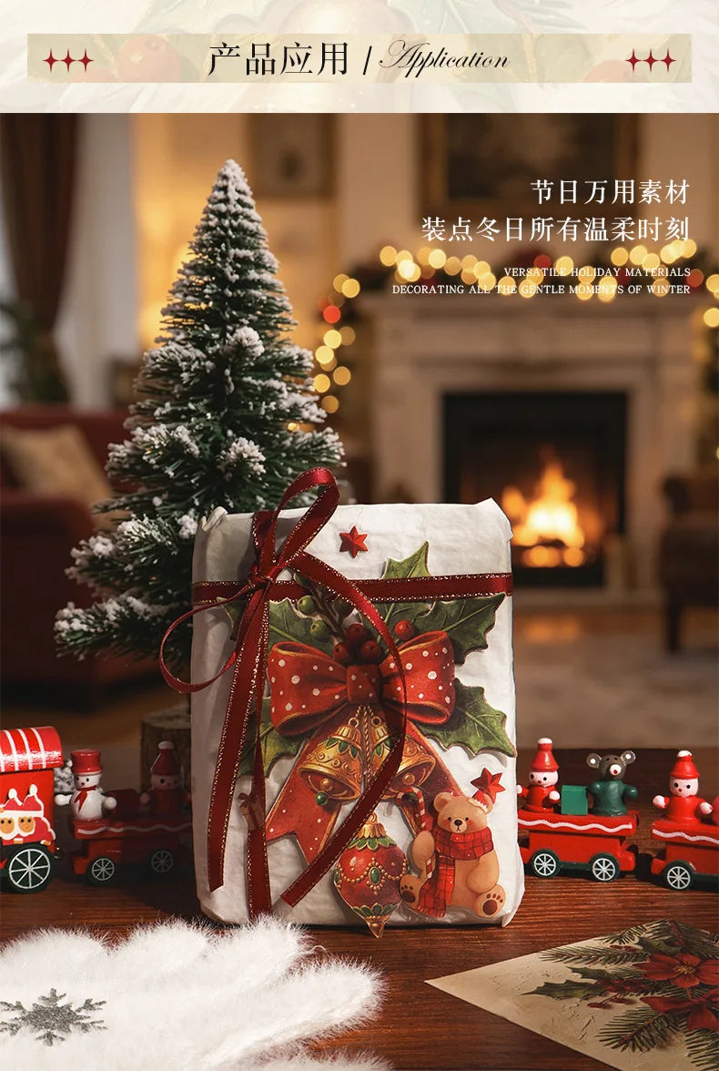 A decorative paper pack featuring Christmas themes and embossed designs, resting on a wooden surface.