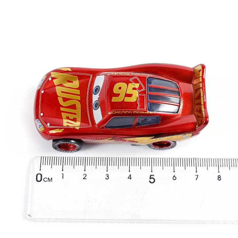 A red diecast toy hauler truck with the number 95 and the Rust-eze logo