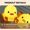 A yellow cartoon duck night light illuminating a hand, providing a warm light atmosphere for sleeping.