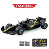 A black 1:64 classic car model racing on a white background.