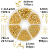 A collection of gold-colored jewelry making supplies including beads, wire, and tools organized in a clear plastic case.