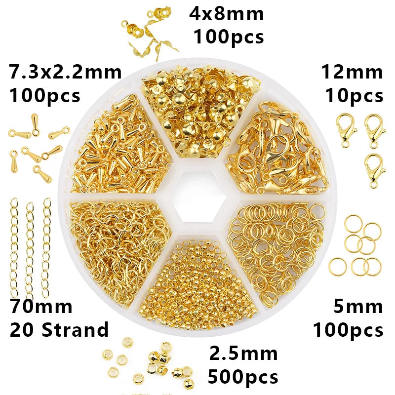 A collection of gold-colored jewelry making supplies including beads, wire, and tools organized in a clear plastic case.
