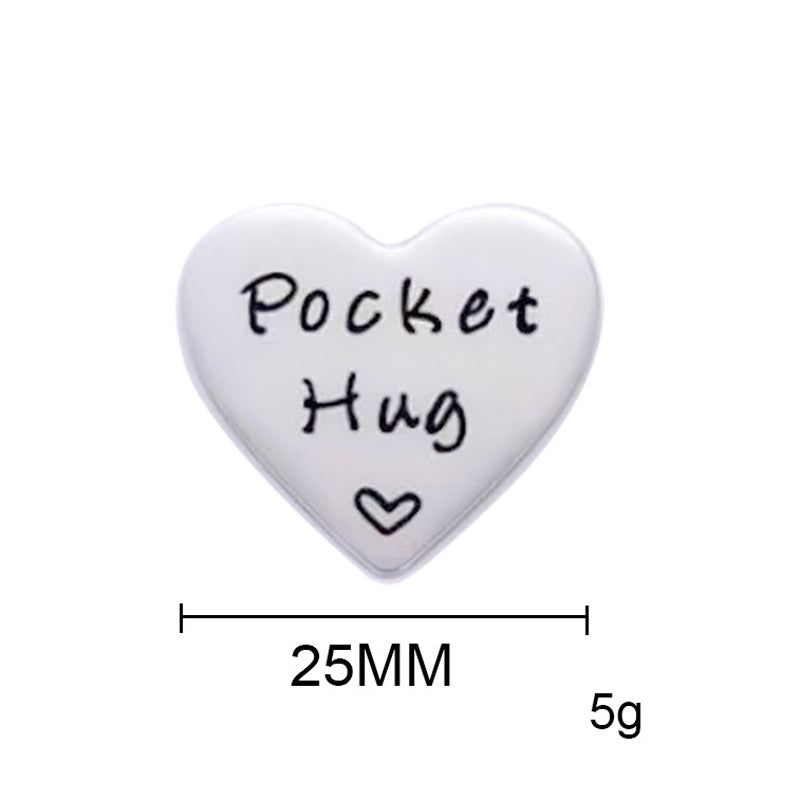 A white heart-shaped token for a pocket hug long distance keepsake gift with keychain.