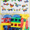 A pile of colorful plastic building blocks in various shapes and colors including red, yellow, blue, and green.