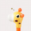 A yellow giraffe spray water toy with orange features and an orange nozzle, set against a light grid background.