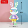 A white and purple building block set shaped like a rabbit wearing a colorful visor and a bear body, displayed against a blue