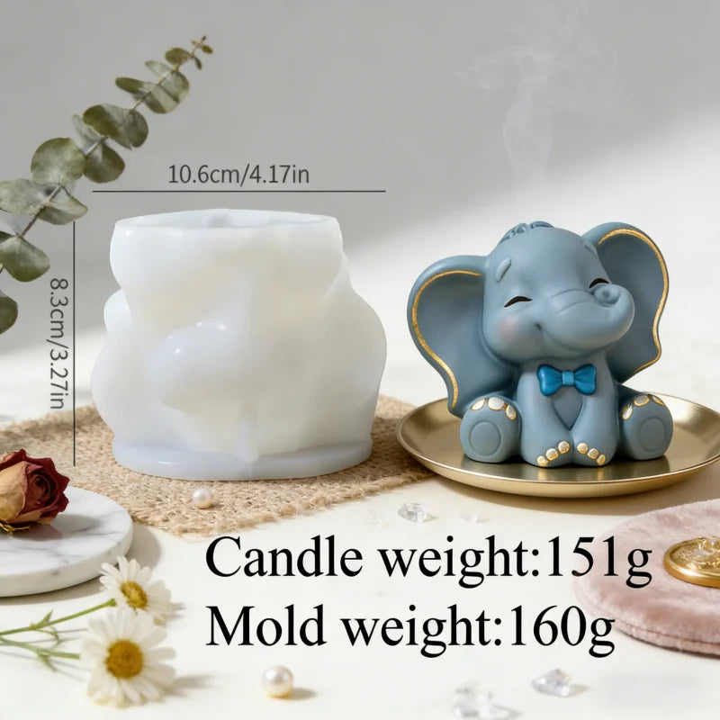 A white silicone mold shaped like an elephant sits next to a candle and shows the weight of the mold is 160g.