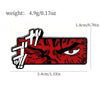 A red enamel lapel pin featuring a fierce, angry face design.