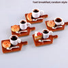 A set of five mini resin coffee cups and food items for a dollhouse kitchen display