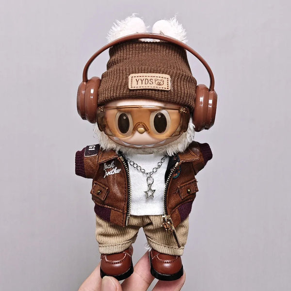 A Labubu doll wearing a brown leather jacket, knit hat with a patch, and brown boots.