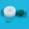 A white silicone mold shaped like a cactus or succulent, shown next to the green finished product.