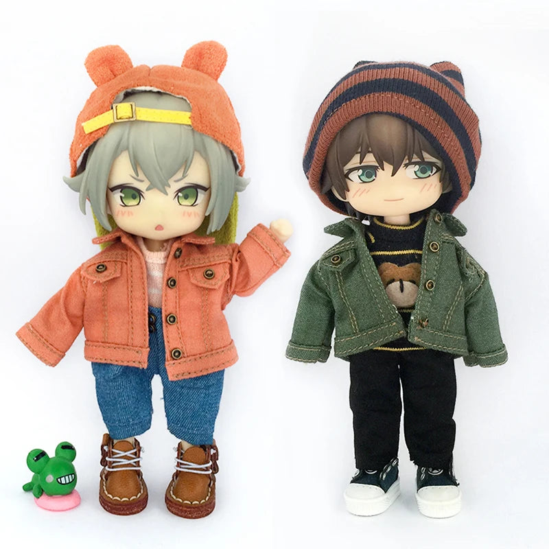 A 1/12 scale doll wearing an orange knitted hat and denim jacket with green eyes.