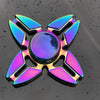 A rainbow metal fidget spinner with a central sphere and four surrounding blades, viewed from above.