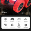 Red off-road stunt car with large tires and LED headlights shown in a close-up view.