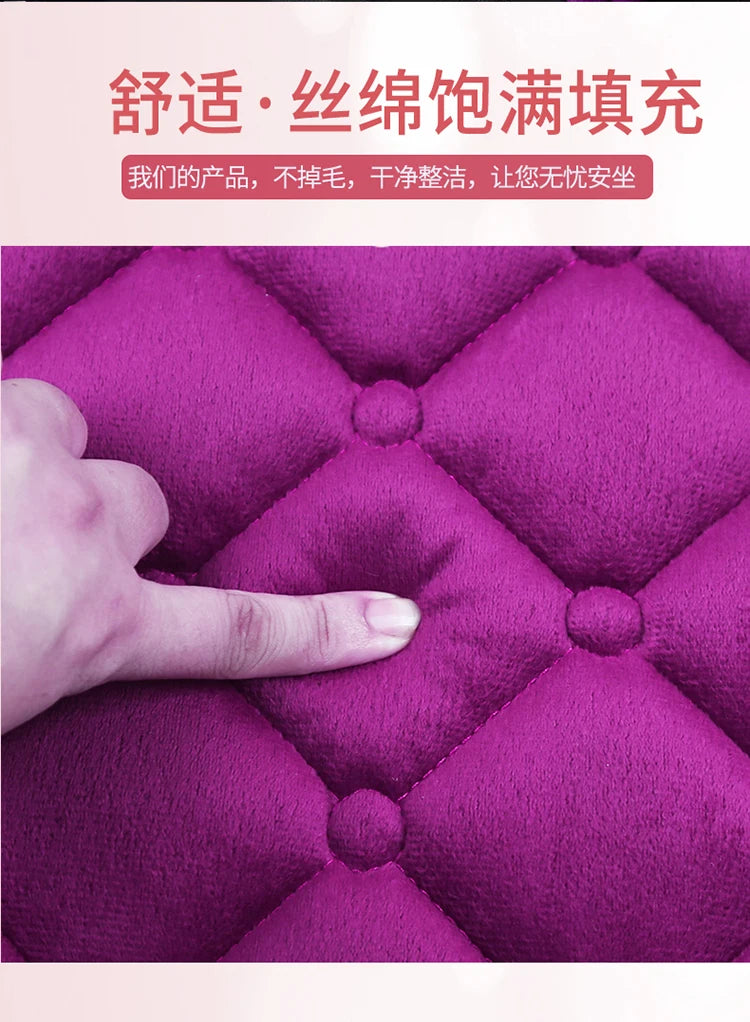 A hand is touching a vibrant purple quilted plush seat cushion, highlighting its texture and softness.