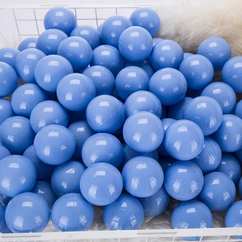 A white tray filled with a 50-pack of light blue and purple play balls.