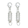 A pair of silver magnetic clasps for jewelry making with spring-loaded connectors.