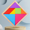 A wooden tangram puzzle set with seven colored pieces arranged in a diamond shape on a light wood base.