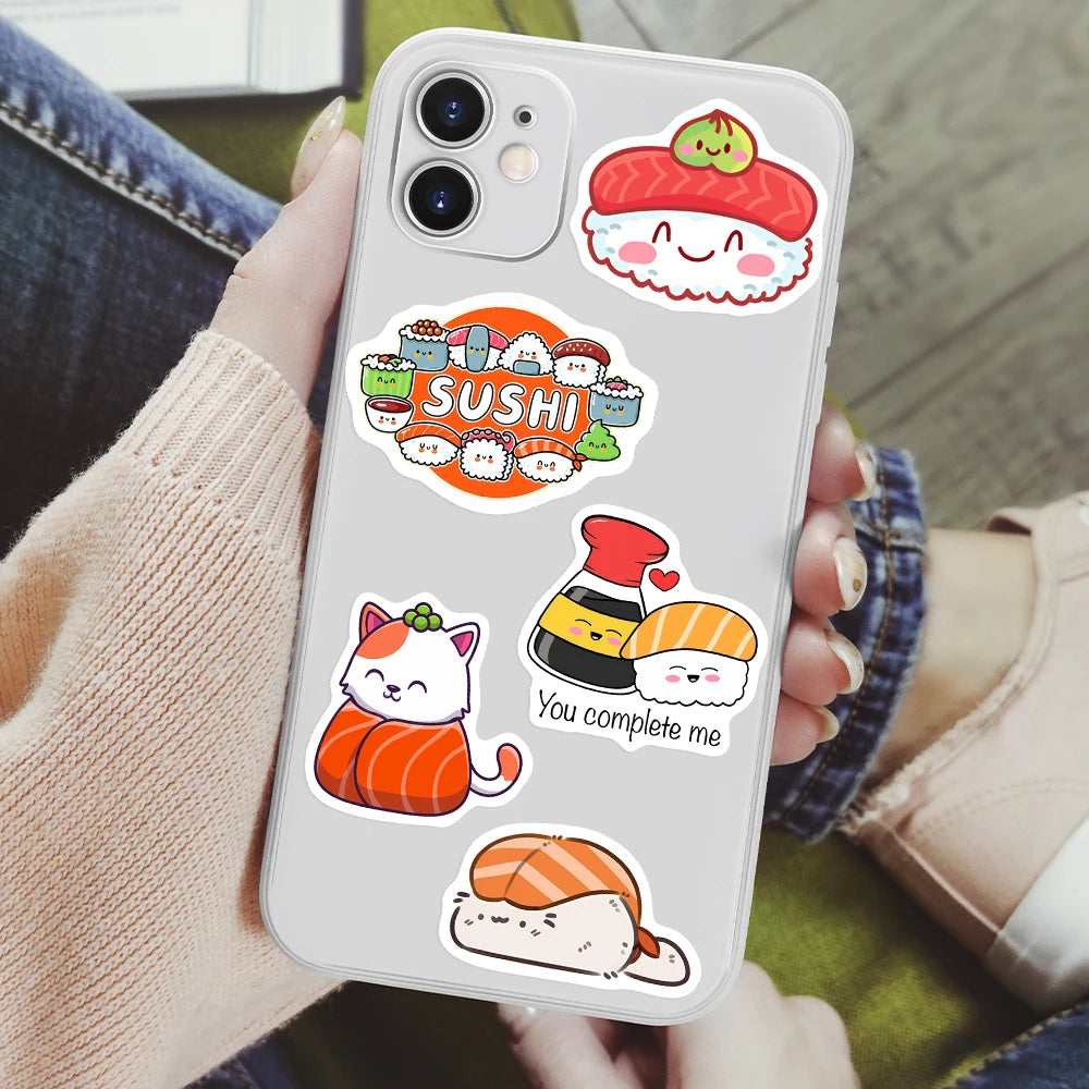 A smartphone displaying a kawaii sushi decal sticker featuring a smiling orange fish character and a red hat.