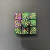 A set of ten dual-color dice showing various positive and negative values like +1, -1, +3, and +2.