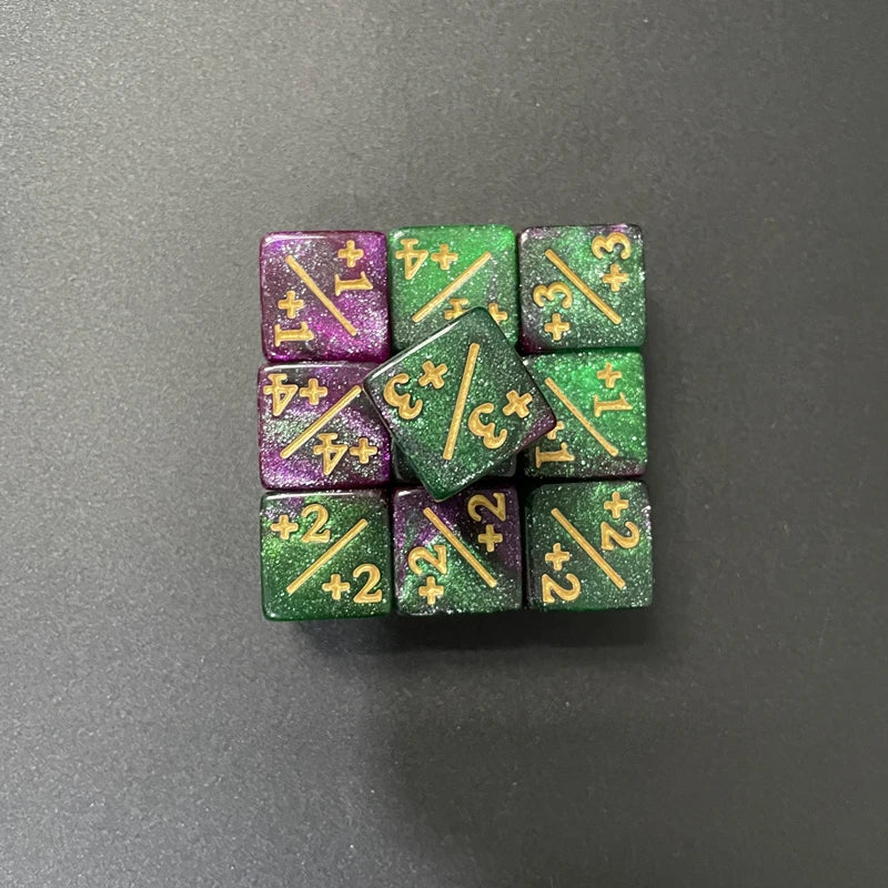 A set of ten dual-color dice showing various positive and negative values like +1, -1, +3, and +2.