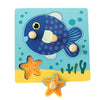 A wooden puzzle featuring a blue fish, orange star, and green cacti for toddlers.