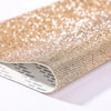 Close-up of sparkling gold rhinestone adhesive tape for DIY crafts and decor